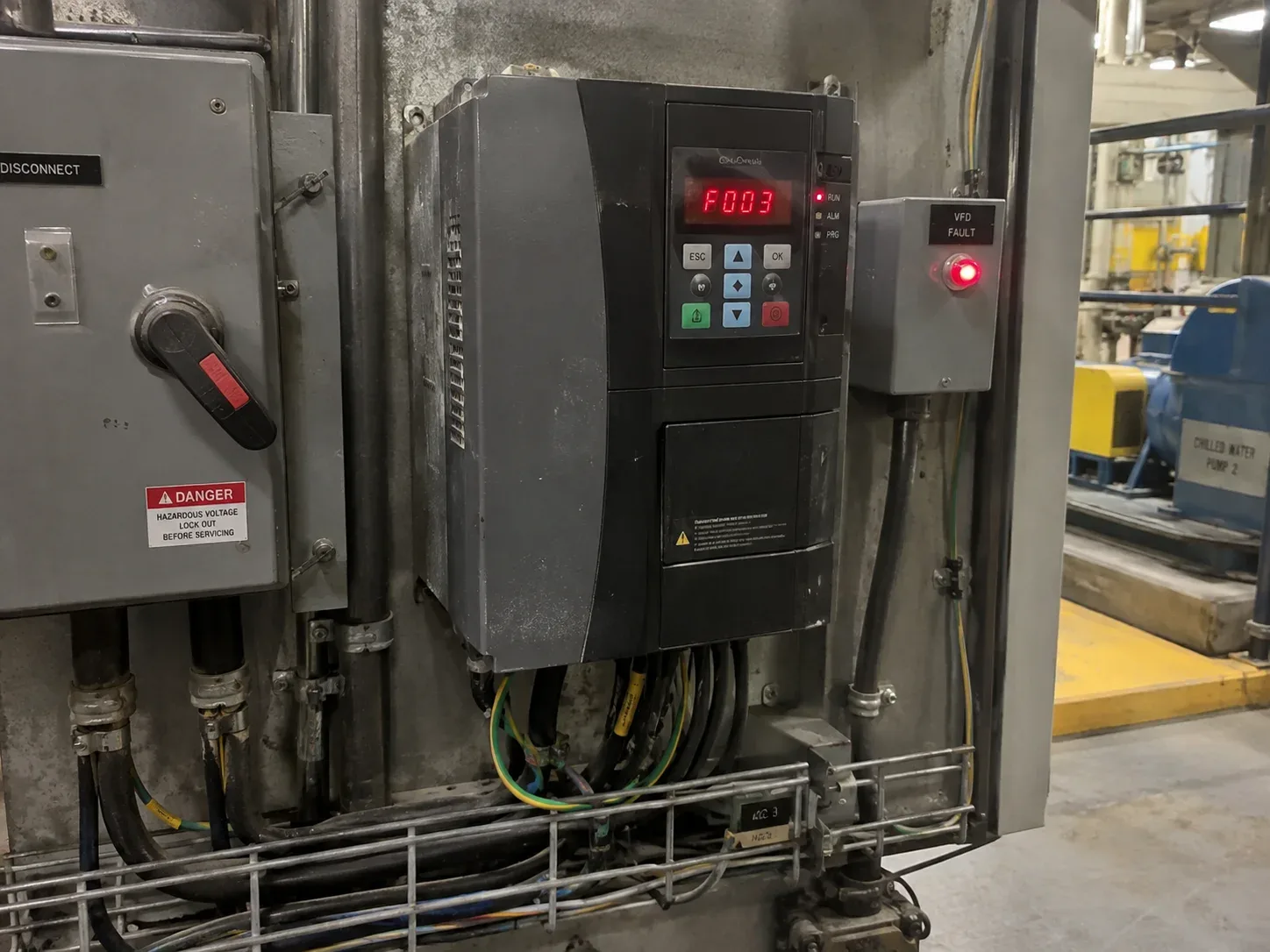 Industrial electrician Aurora troubleshooting electrical equipment during a breakdown